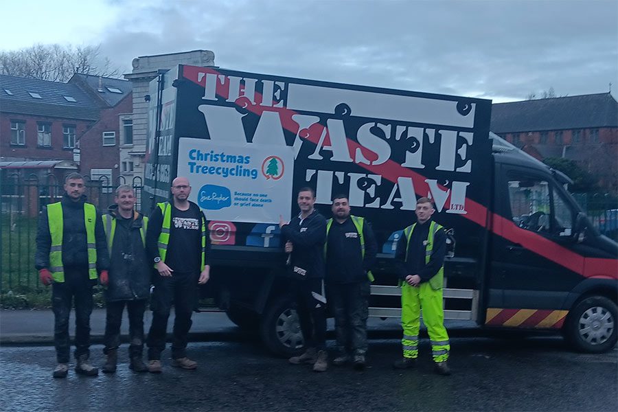 Waste team standing in front of van
