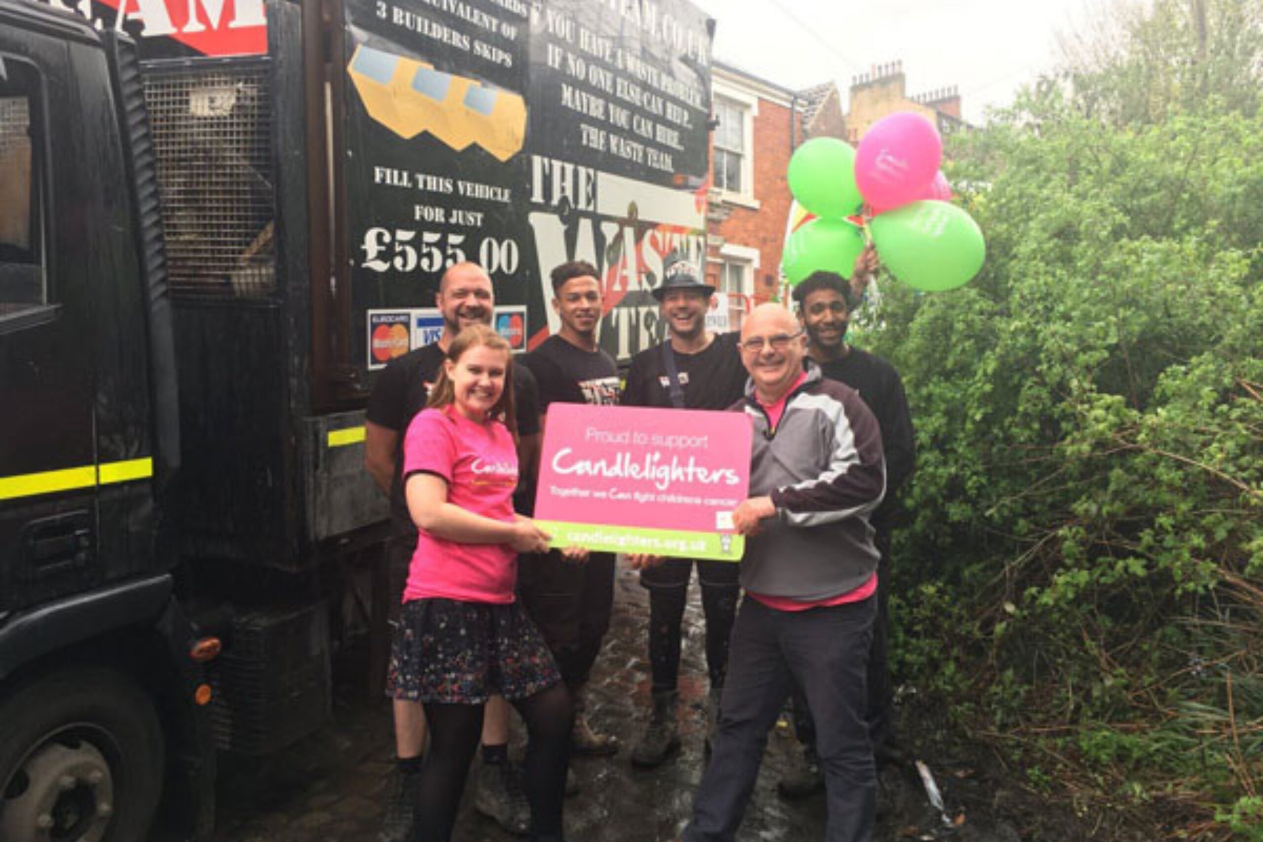 Waste team with Candlelighters charity banner
