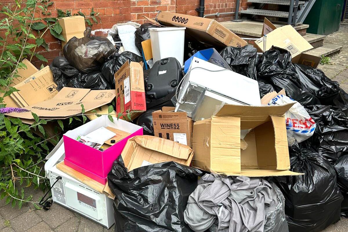 A mass of waste bins and bags from a commercial building