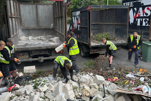 The Waste Team clearing rubbish into lorry