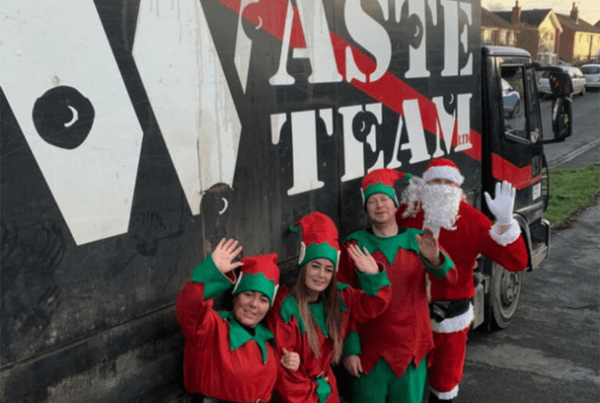 The Waste Team workers dressed as three elves and santa claus