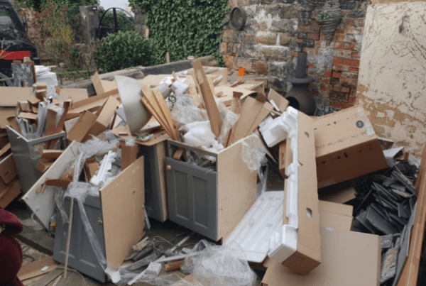 various waste items plied up in a garden