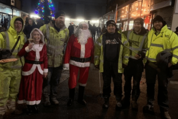 5 men in high vis jackets with santa and mrs claus at Meanwood Christmas lights switch on
